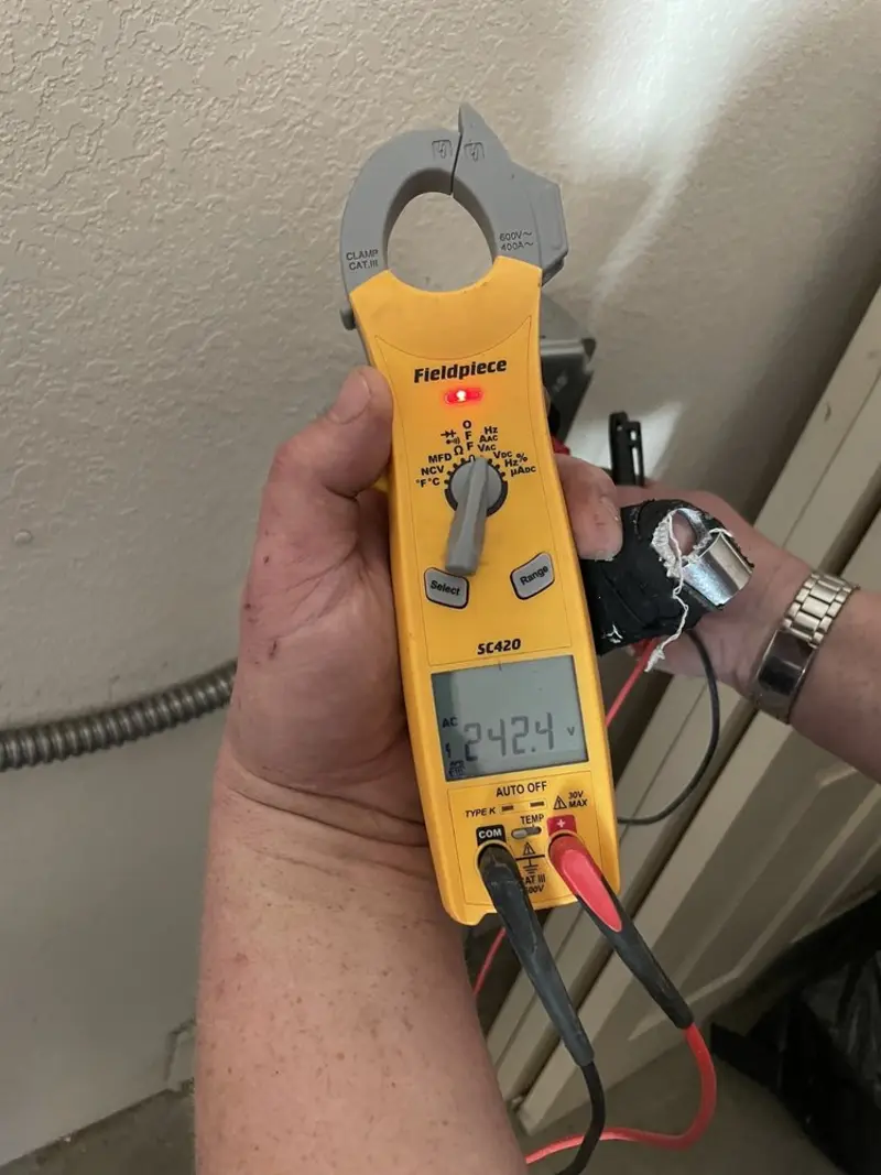 Voltage testing with clamp meter during Ceiling Fan Installation in Quakertown